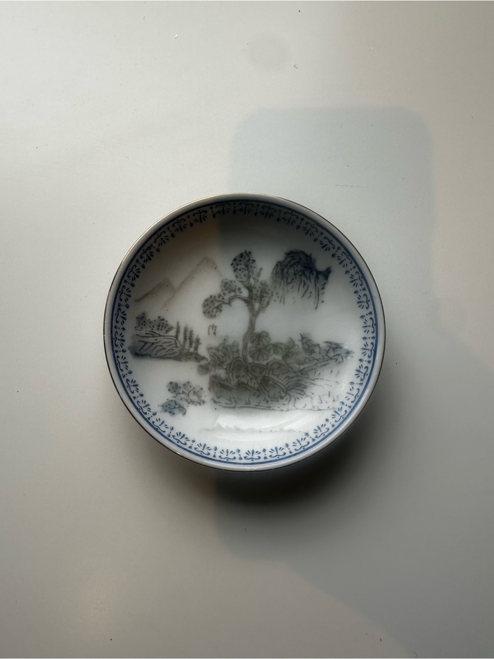 Blue and White Porcelain Decorative Plate with Landscape Motif